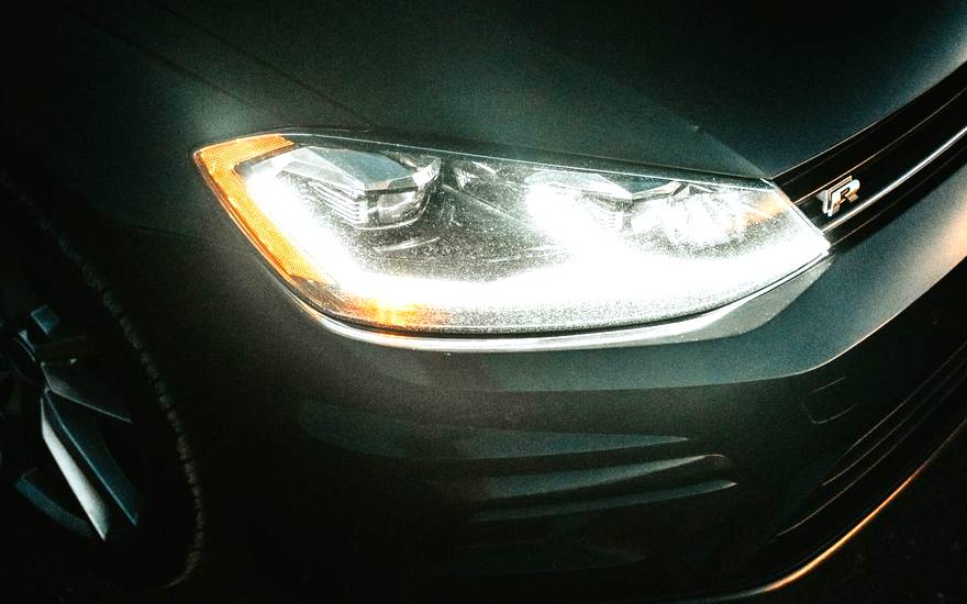 Web design for automotive businesses, shown with a car headlight